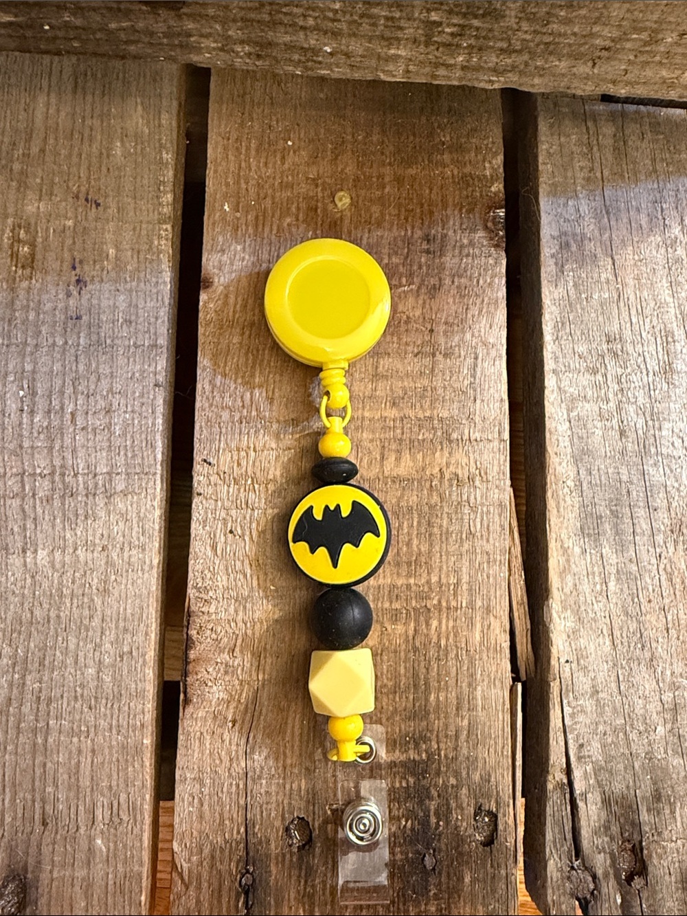 Yellow and Black Badge Reel with Bat Emblem